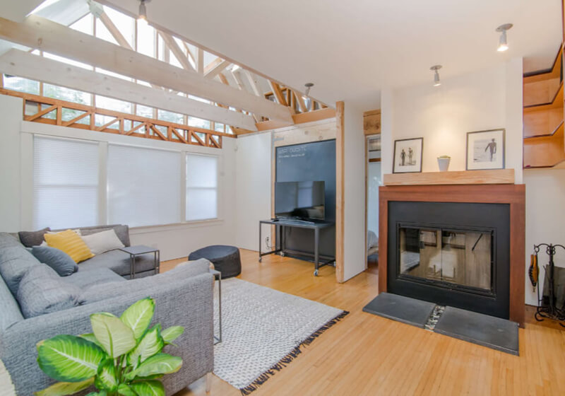 interior of a wooden home with above lighting features